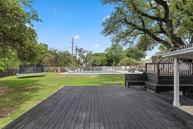 13201 Stillforest St, Austin, TX 78729 - wooden deck featuring a trampoline