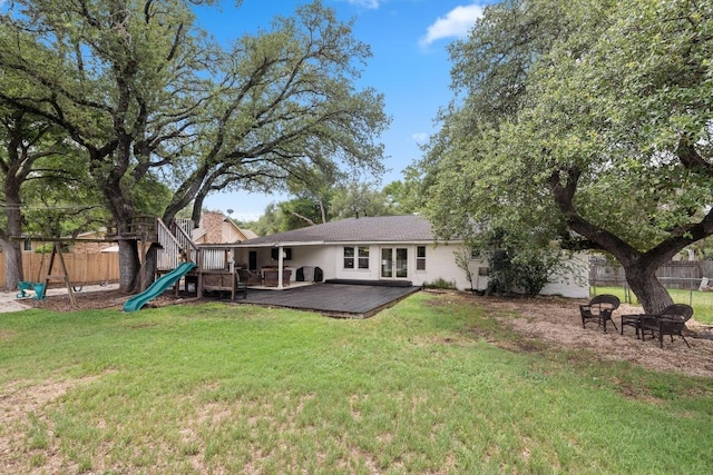 13201 Stillforest St, Austin, TX 78729 - back of property with a deck and a playground