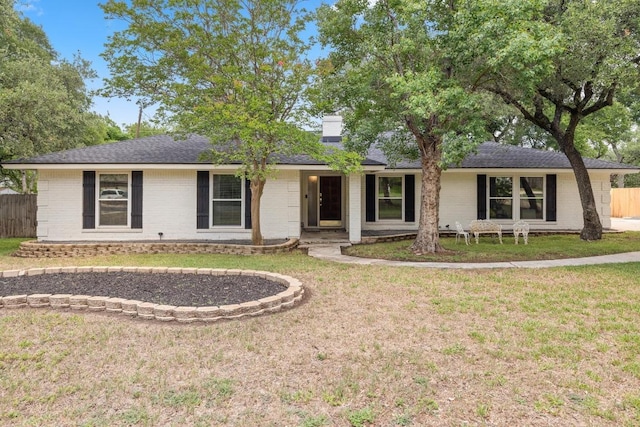13201 Stillforest St, Austin, TX 78729 - ranch-style house with brick siding, a chimney, and a shingled roof