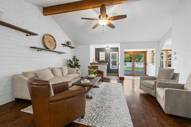 13201 Stillforest St, Austin, TX 78729 - living area featuring wood walls, hardwood / wood-style floors, ceiling fan, and arched walkways