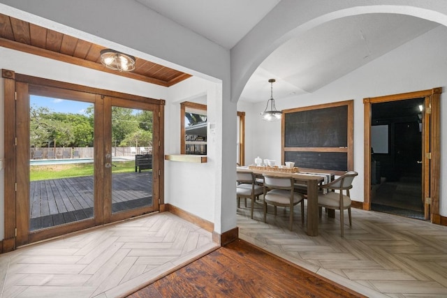 13201 Stillforest St, Austin, TX 78729 - foyer featuring baseboards, lofted ceiling, arched walkways, and a chandelier