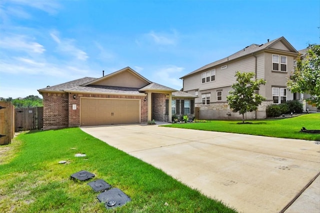 320 Bright Star Ln, Georgetown, TX 78628 - view of front of property with an attached garage, concrete driveway, and brick siding