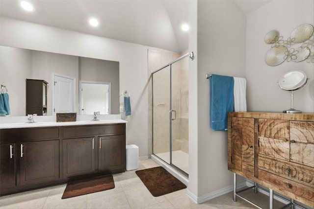 320 Bright Star Ln, Georgetown, TX 78628 - bathroom with a shower stall, double vanity, vaulted ceiling, tile patterned flooring, and recessed lighting