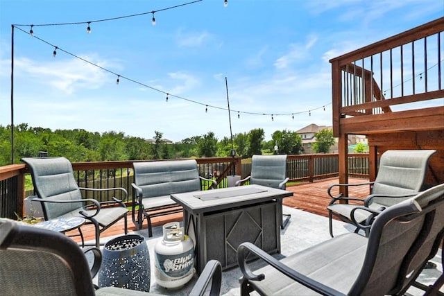 320 Bright Star Ln, Georgetown, TX 78628 - wooden terrace with an outdoor fire pit