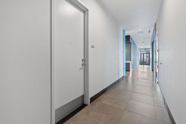 222 W Ave Unit 1001, Austin, TX 78701 - hall featuring baseboards and recessed lighting