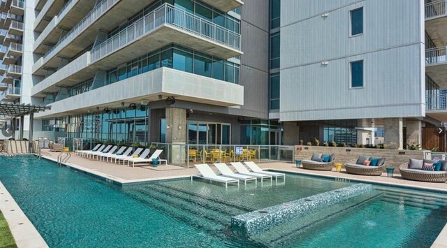 222 W Ave Unit 1001, Austin, TX 78701 - community pool featuring an outdoor living space and a patio area
