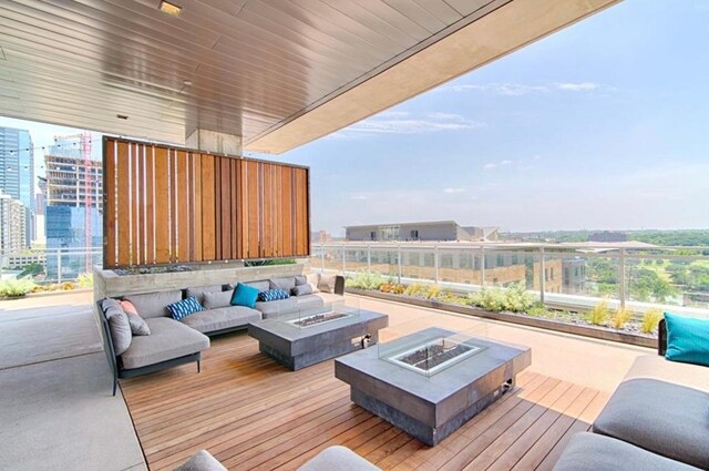 222 W Ave Unit 1001, Austin, TX 78701 - wooden deck with an outdoor living space with a fire pit