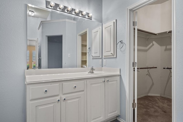 2141 Rachel Ln, Round Rock, TX 78664 - bathroom featuring vanity and a spacious closet