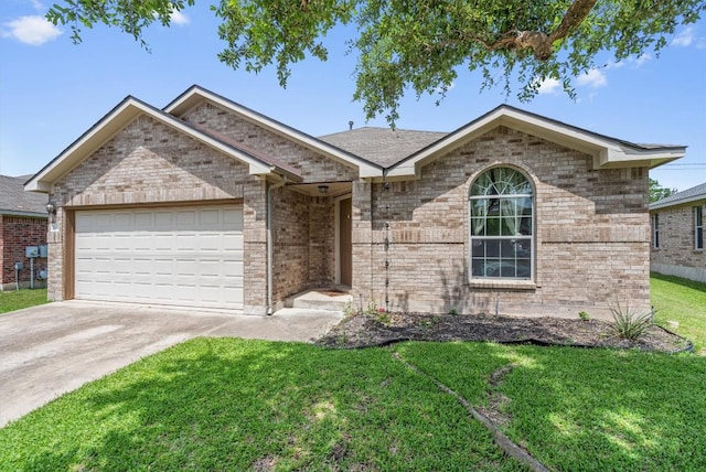 2141 Rachel Ln, Round Rock, TX 78664 - ranch-style house with an attached garage, a front lawn, concrete driveway, and brick siding