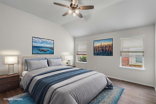 2141 Rachel Ln, Round Rock, TX 78664 - bedroom featuring wood finished floors, vaulted ceiling, baseboards, and ceiling fan
