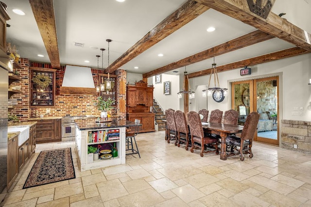 1606 Bordeaux Blanc, New Braunfels, TX 78132 - dining area with stairs, stone tile flooring, beam ceiling, recessed lighting, and a chandelier