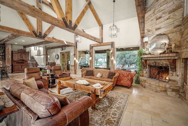 1606 Bordeaux Blanc, New Braunfels, TX 78132 - living room featuring high vaulted ceiling, stone tile flooring, beamed ceiling, a stone fireplace, and a chandelier
