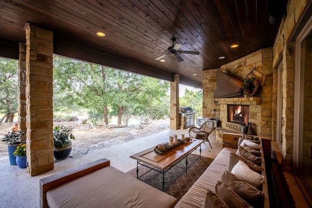 1606 Bordeaux Blanc, New Braunfels, TX 78132 - view of patio / terrace with ceiling fan and an outdoor living space with a fireplace