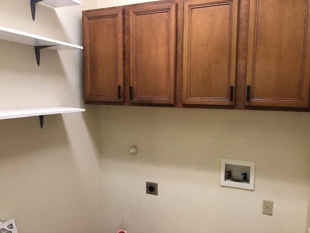22340 Briarcliff Dr, Spicewood, TX 78669 - laundry room featuring electric dryer hookup, hookup for a washing machine, and cabinet space