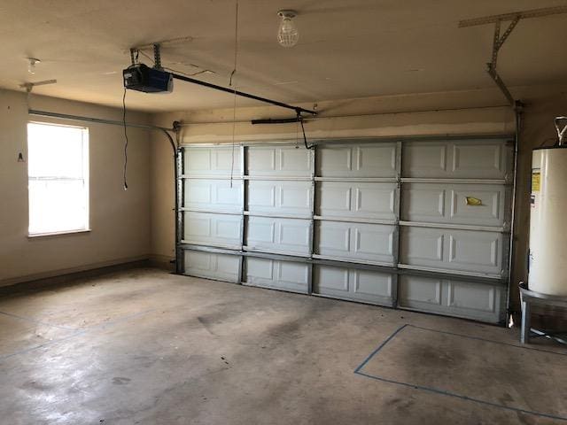 22340 Briarcliff Dr, Spicewood, TX 78669 - garage featuring gas water heater and a garage door opener