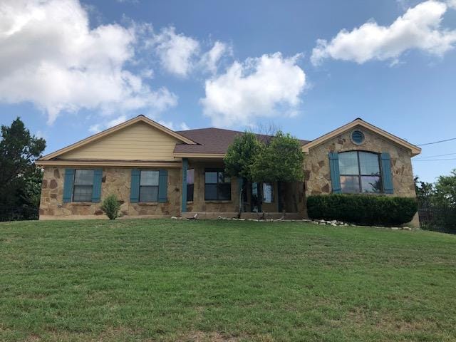22340 Briarcliff Dr, Spicewood, TX 78669 - single story home with a front lawn