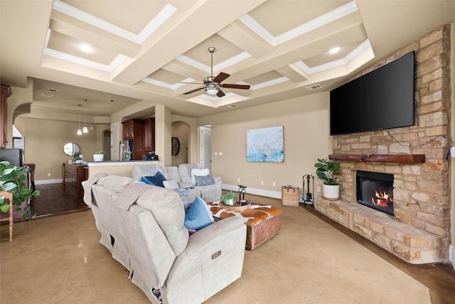 121 White Wash, Dripping Springs, TX 78620 - living room featuring arched walkways, coffered ceiling, a fireplace, a ceiling fan, and baseboards