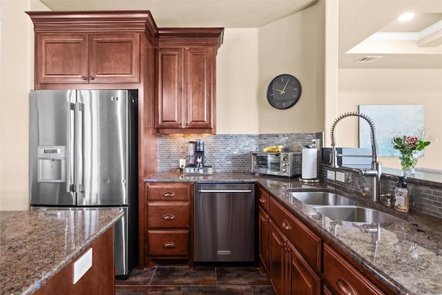 121 White Wash, Dripping Springs, TX 78620 - kitchen with stainless steel appliances, a sink, dark stone counters, and decorative backsplash