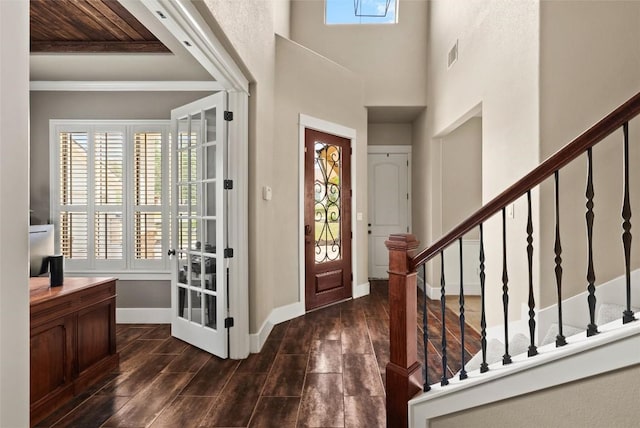 121 White Wash, Dripping Springs, TX 78620 - entryway with dark wood finished floors, baseboards, stairs, and ornamental molding