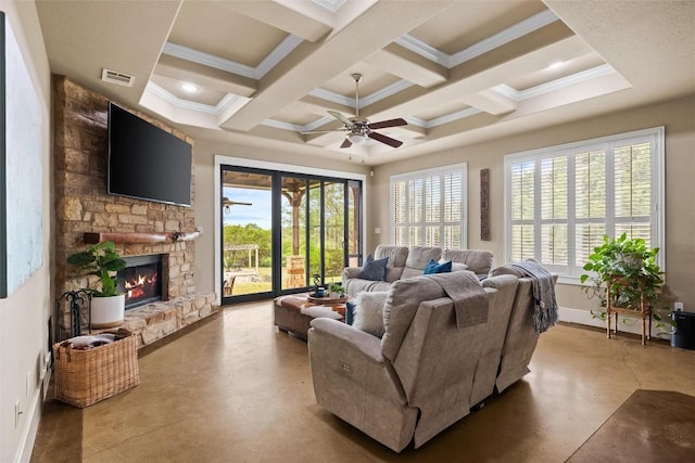 121 White Wash, Dripping Springs, TX 78620 - living area with concrete flooring, beamed ceiling, a fireplace, ceiling fan, and crown molding