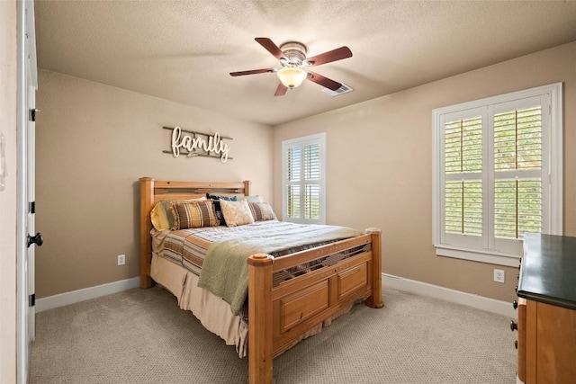 121 White Wash, Dripping Springs, TX 78620 - bedroom with baseboards, light colored carpet, and ceiling fan