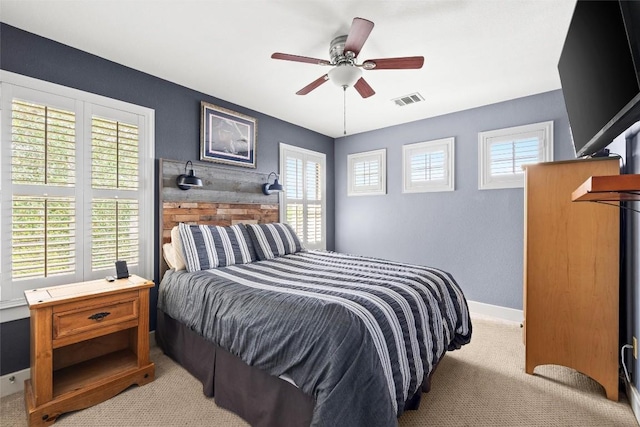 121 White Wash, Dripping Springs, TX 78620 - bedroom with light colored carpet, baseboards, and ceiling fan