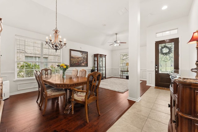 2600 Lost Mine Trl, Leander, TX 78641 - dining space featuring a decorative wall, ceiling fan, a chandelier, wood finished floors, and wainscoting