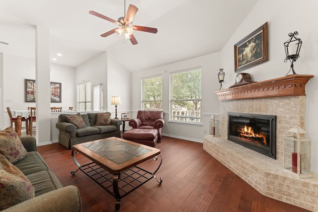 2600 Lost Mine Trl, Leander, TX 78641 - living room with a brick fireplace, a ceiling fan, wood finished floors, and high vaulted ceiling