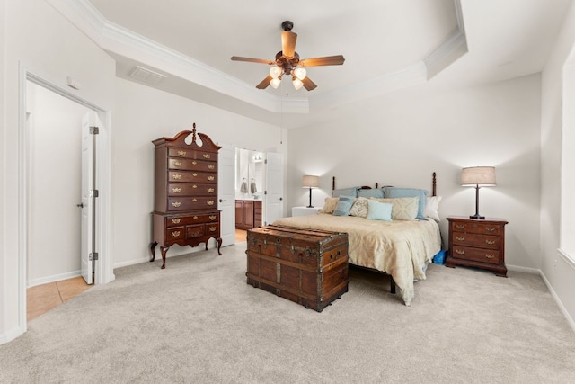 2600 Lost Mine Trl, Leander, TX 78641 - bedroom featuring light carpet, crown molding, a tray ceiling, ensuite bath, and ceiling fan