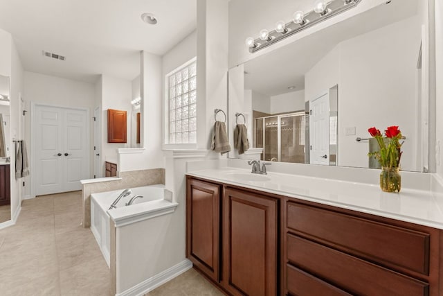 2600 Lost Mine Trl, Leander, TX 78641 - full bath with a shower stall, vanity, a bath, and tile patterned floors