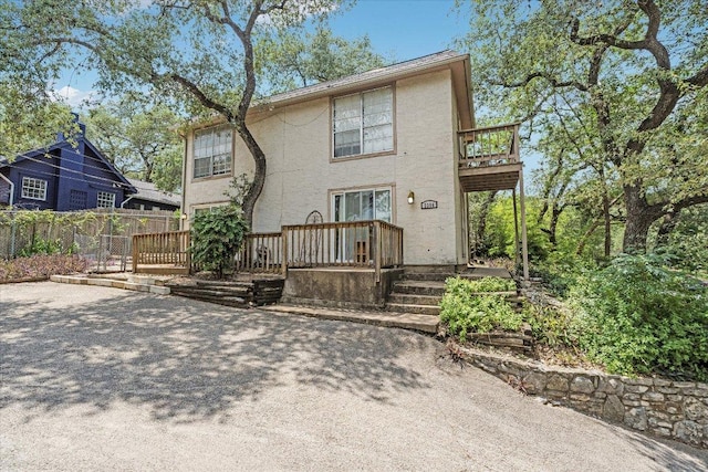 3304 Clawson Rd, Austin, TX 78704 - back of property with stucco siding, a deck, and a balcony