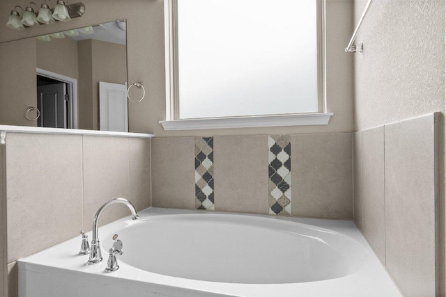 202 Westfield St, Hutto, TX 78634 - bathroom with plenty of natural light and a garden tub