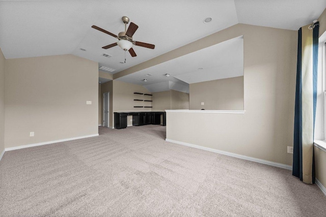 202 Westfield St, Hutto, TX 78634 - unfurnished living room featuring vaulted ceiling, carpet, a ceiling fan, and baseboards