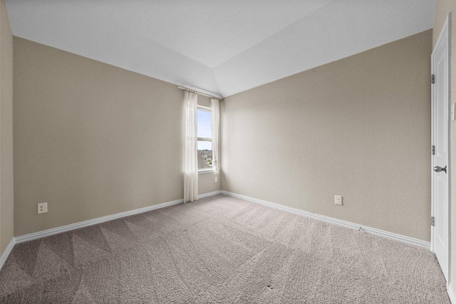 202 Westfield St, Hutto, TX 78634 - carpeted empty room with baseboards and lofted ceiling