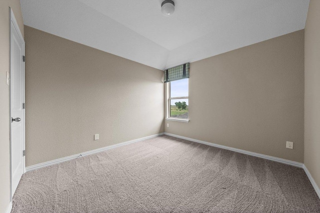 202 Westfield St, Hutto, TX 78634 - empty room featuring carpet floors, baseboards, and lofted ceiling