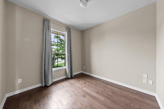 202 Westfield St, Hutto, TX 78634 - empty room with wood finished floors and baseboards