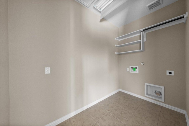 202 Westfield St, Hutto, TX 78634 - washroom with gas dryer hookup, electric dryer hookup, washer hookup, tile patterned flooring, and baseboards