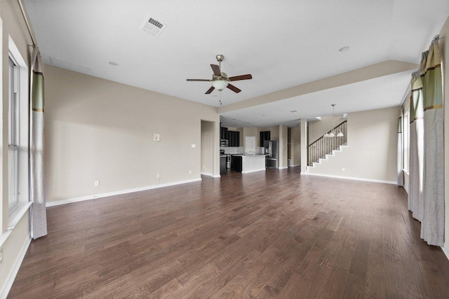 202 Westfield St, Hutto, TX 78634 - unfurnished living room with stairs, baseboards, a ceiling fan, and dark wood-type flooring