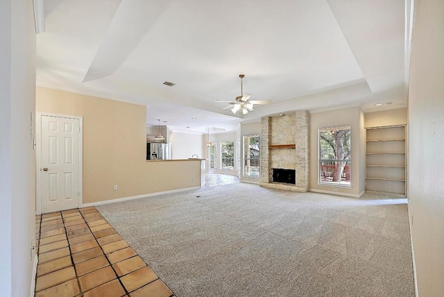106 Los Altos Dr, Lakeway, TX 78734 - unfurnished living room featuring carpet flooring, a ceiling fan, built in features, baseboards, and a fireplace