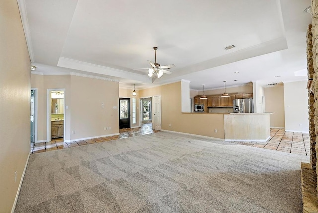106 Los Altos Dr, Lakeway, TX 78734 - unfurnished living room with a raised ceiling, ornamental molding, light colored carpet, a ceiling fan, and baseboards