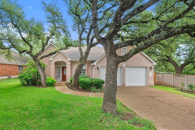 10601 Beckwood Dr, Austin, TX 78726 - view of front facade featuring concrete driveway, brick siding, and an attached garage
