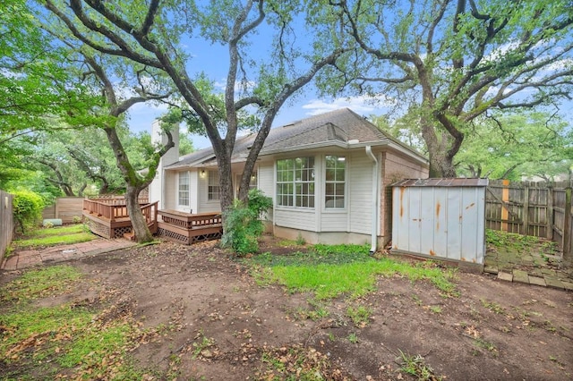 10601 Beckwood Dr, Austin, TX 78726 - view of front of property with a fenced backyard, a wooden deck, and roof with shingles