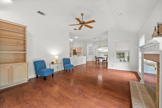 10601 Beckwood Dr, Austin, TX 78726 - sitting room featuring lofted ceiling, ceiling fan, a fireplace, and wood finished floors
