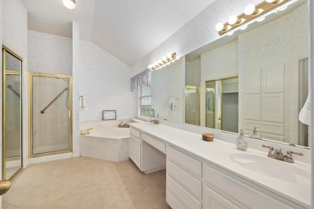 10601 Beckwood Dr, Austin, TX 78726 - full bath featuring wallpapered walls, double vanity, a bath, a stall shower, and lofted ceiling