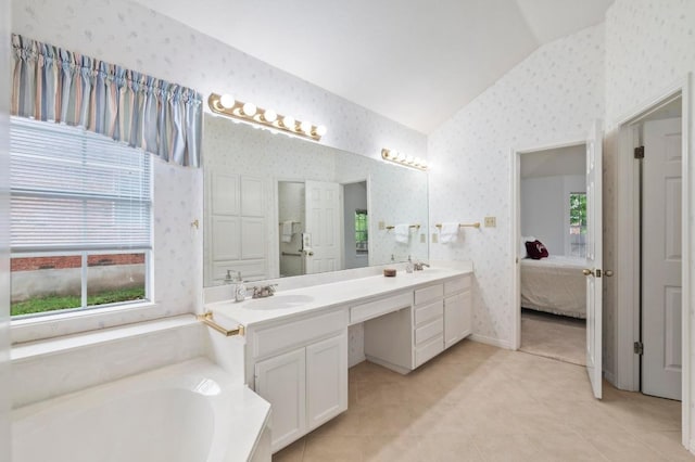 10601 Beckwood Dr, Austin, TX 78726 - full bath with vaulted ceiling, wallpapered walls, double vanity, connected bathroom, and a garden tub