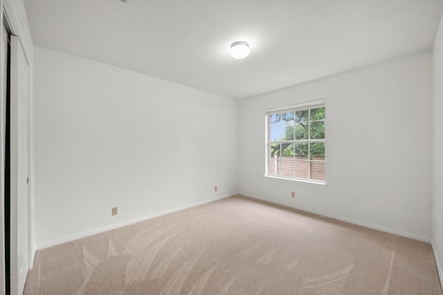10601 Beckwood Dr, Austin, TX 78726 - carpeted spare room featuring baseboards
