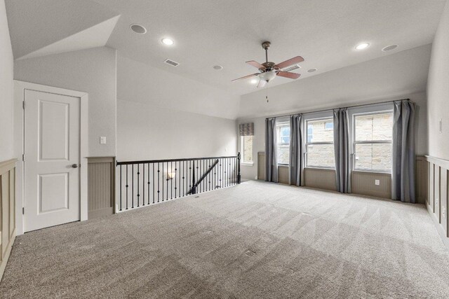 20525 Martin Ln, Pflugerville, TX 78660 - spare room with lofted ceiling, ceiling fan, carpet flooring, and recessed lighting