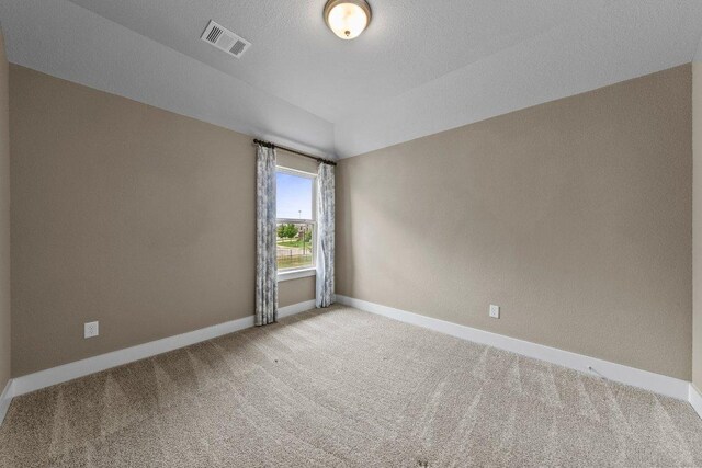 20525 Martin Ln, Pflugerville, TX 78660 - empty room with light colored carpet, baseboards, and lofted ceiling