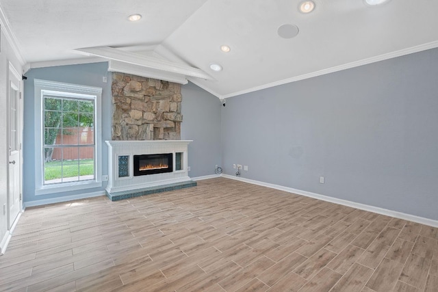 1515 Mearns Meadow Blvd, Austin, TX 78758 - unfurnished living room with crown molding, vaulted ceiling, baseboards, a large fireplace, and light wood finished floors