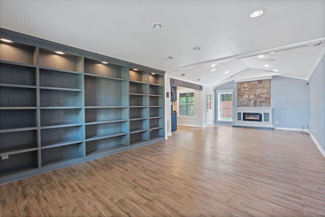 1515 Mearns Meadow Blvd, Austin, TX 78758 - unfurnished living room with baseboards, wood finished floors, recessed lighting, vaulted ceiling, and crown molding